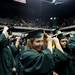 Eastern Michigan University graduates flip their tassels to the other side of their cap signifying graduation during Commencement on Sunday, April 28. Daniel Brenner I AnnArbor.com